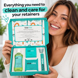 Woman holding an open Blakmint retainer care kit box with liquid cleaner, aligner case, brush and thank you card